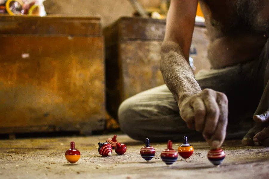 The colour goes on while the piece is still spinning